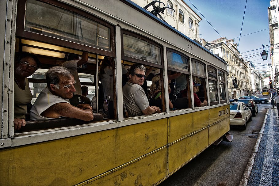 people, inside, yellow, white, tram, road, daytime, portugal, tramway, classic