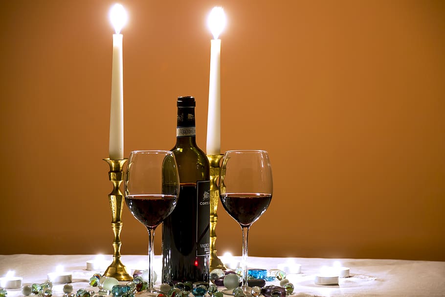 closeup, photography, 3/4, full, wine bottle, middle, tall, candlestick, wine glasses, wine