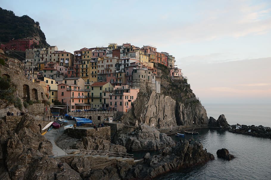 assorted-color buildings, cliff, daytime, manarola, liguria, spice, boat, colors, colorful, boats