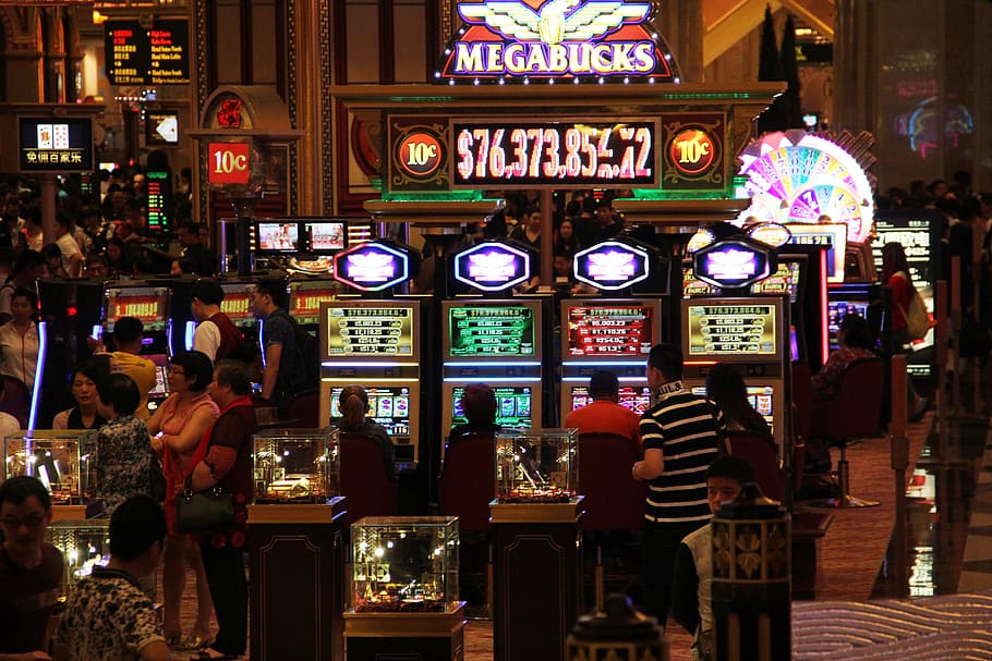 man, walking, front, slot machines, casino, entertainment, macau, culture, style, illuminated
