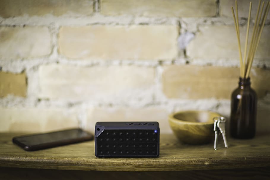 selective, focus photography, black, cordless, electronic, device, smartphone, table, bluetooth, speaker