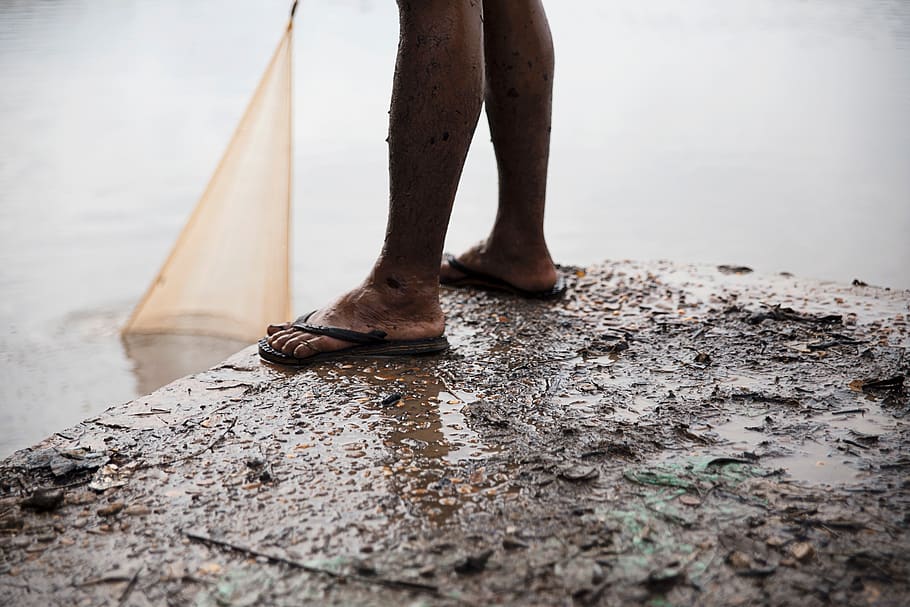 people, man, dirt, mud, slippers, water, low section, human leg, body part, human body part