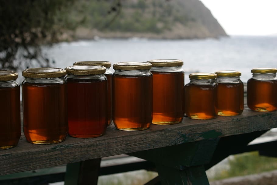 clear, glass jars, filled, brown, liquid, honey, jars, bench, coast, healthy