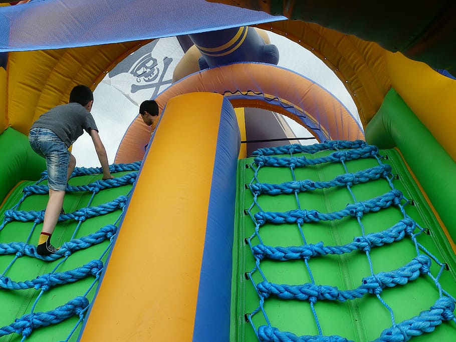 boy, climbing, blue, ladder, pirate ship, bouncy castle, inflatable, colorful, children, play