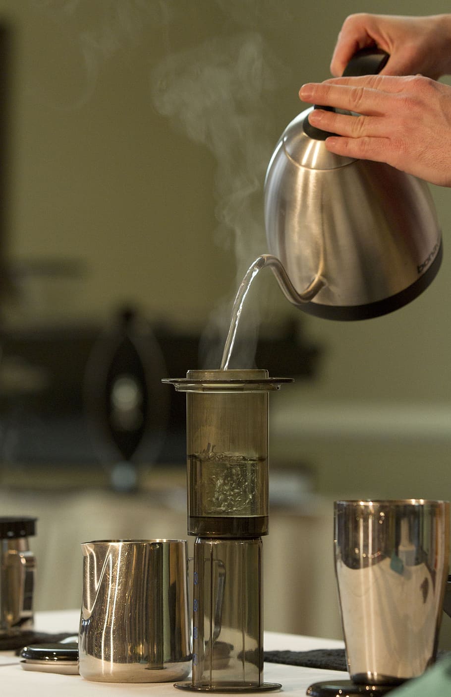 person, pouring, hot, water, gray, glass bottle, coffee making, aero press, coffee, tea