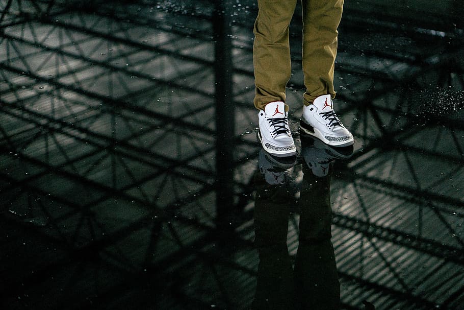 person, wearing, air jordan basketball shoes, pair, white, black, air, jordan, shoes, footwear