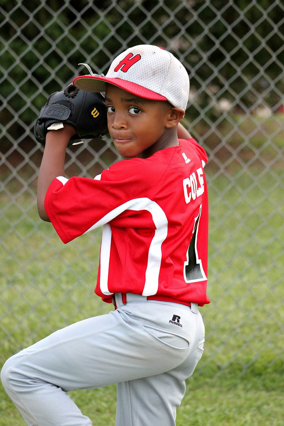 baseball player kid, wearing, red, white, jersey shirt, pants outfit, boy, player, baseball, pitcher