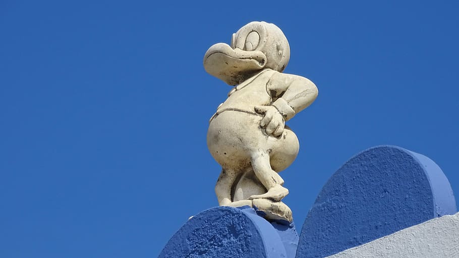 donald duck, blue, sculpture, statue, low angle view, clear sky, sky, outdoors, close-up, day