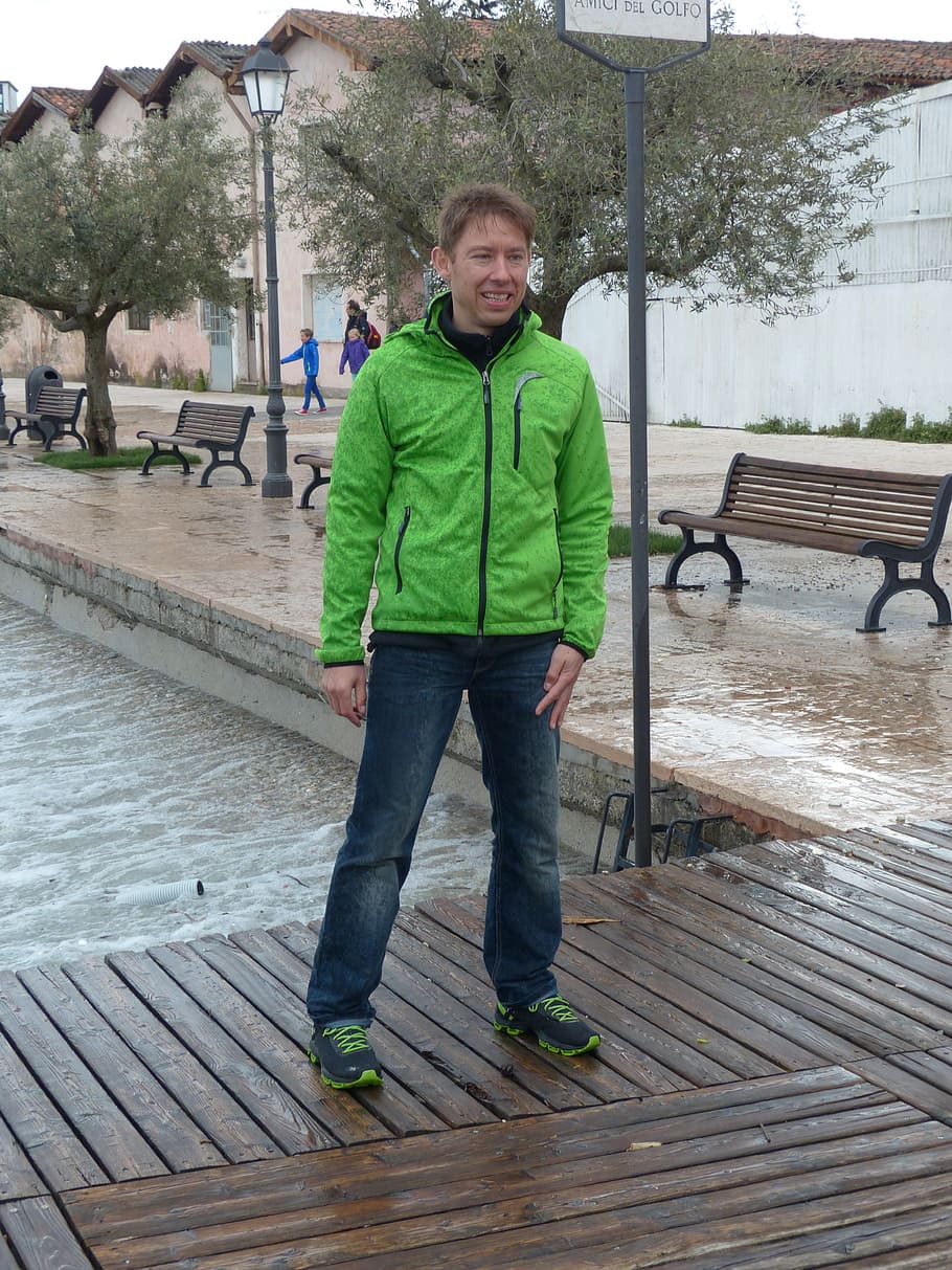 man, person, wet, soaked, jacket, green, one person, real people, full length, architecture