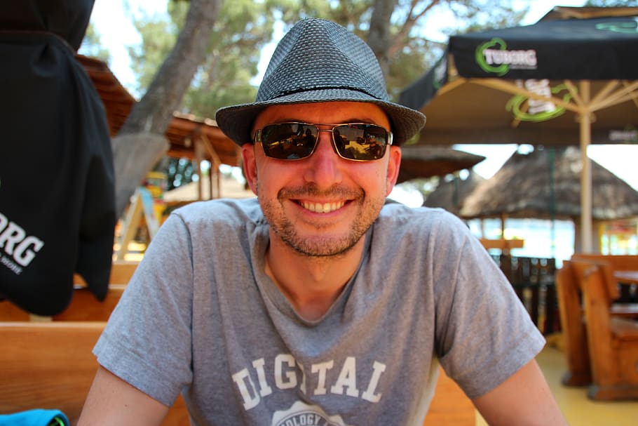 happy, man, digital nomad, hat, sunglasses, vacations, portrait, front view, smiling, happiness