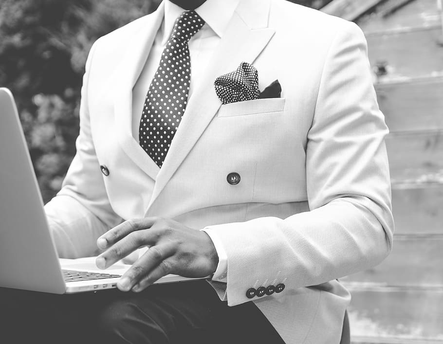 grayscale photo, man, wearing, white, suit, laptop, lap, grayscale, business, businessman