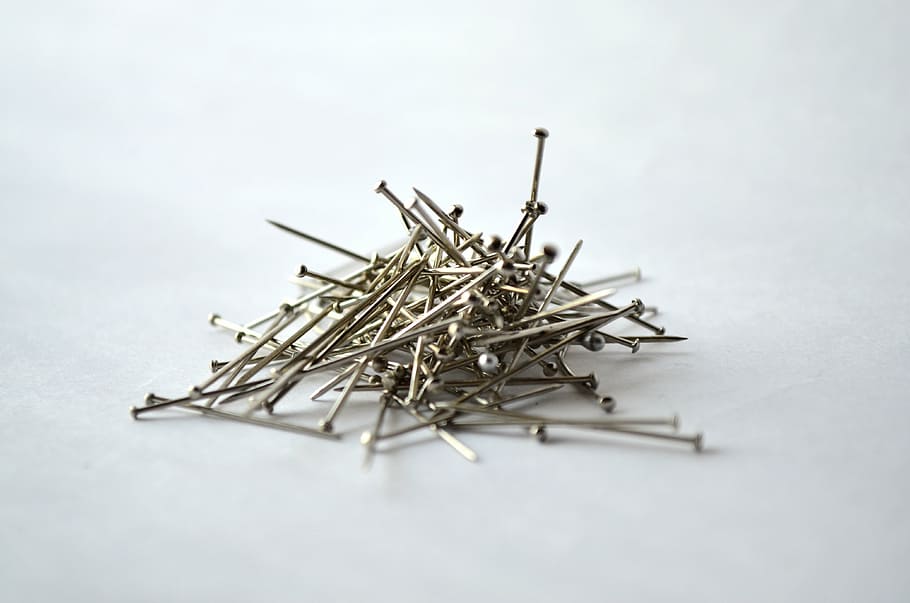 pins, needles, office, stationery, nails, metal, studio shot, indoors, large group of objects, white background