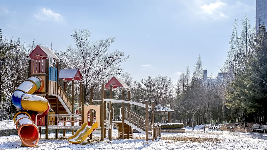 red, blue, yellow, slide playground, covered, snow, playground, sky, apartments, winter