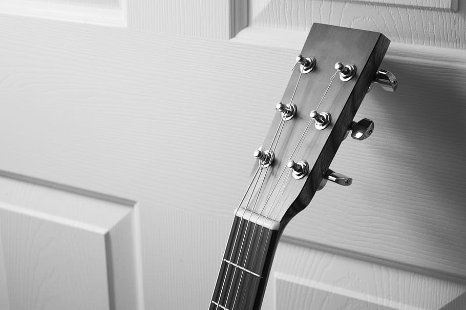grayscale photography, guitar headstock, leaning, door, black and white, music, musical instrument, guitar, instrument, acoustic guitar