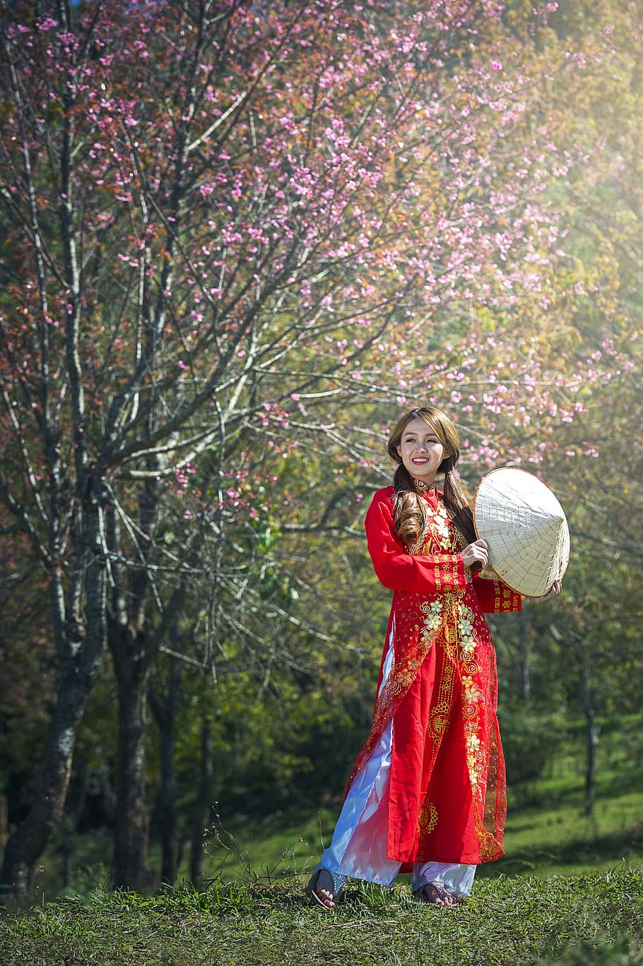woman, wearing, red, traditional, dress, standing, grass fielkd, action, adult, scared of