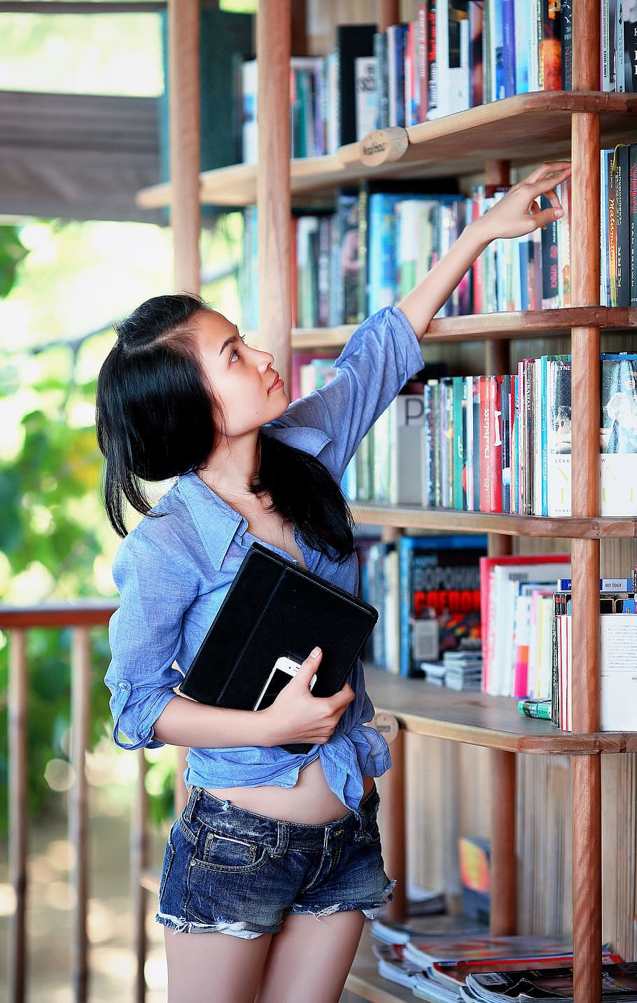 woman, blue, sport shirt, reaching, book, bookcase, girl, library, education, student
