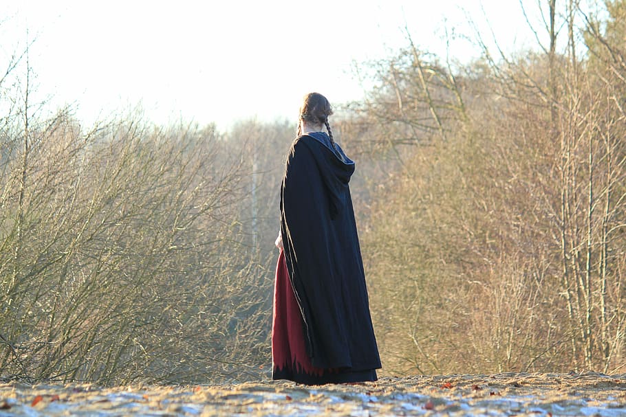 woman, wearing, black, dress, standing, pathway, brown, trees, hair, woven