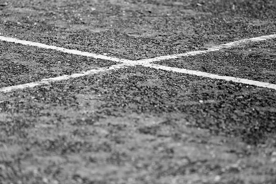 grayscale photograph, floor line, b w, black and white, car park, cross, dirt, lines, tarmac, tarmac road