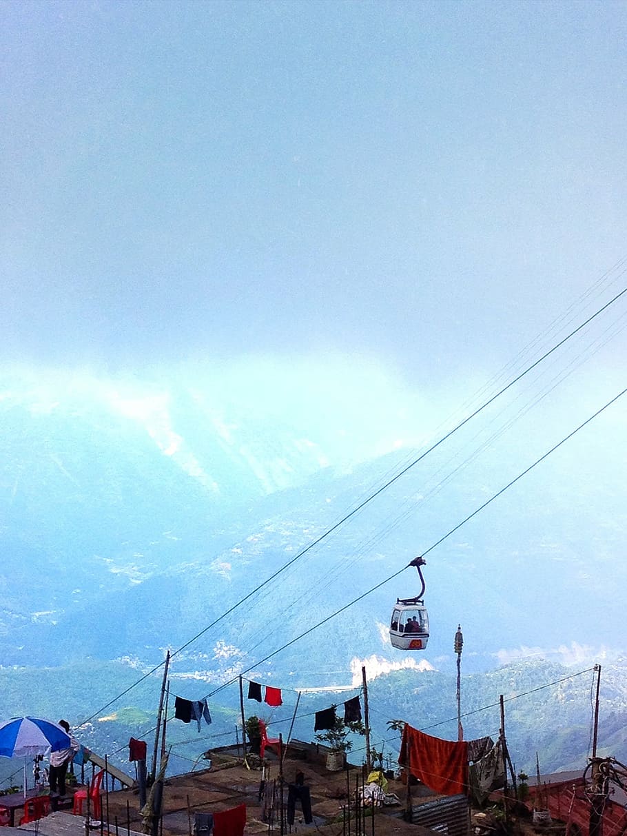 people, riding, cable car, overlooking, mountains, daytime, white, box, strolling, zip