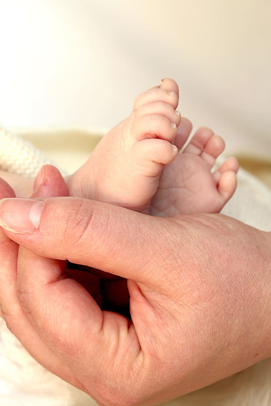 person, touching, baby, foot, feet, baby feet, child, small child, small, young