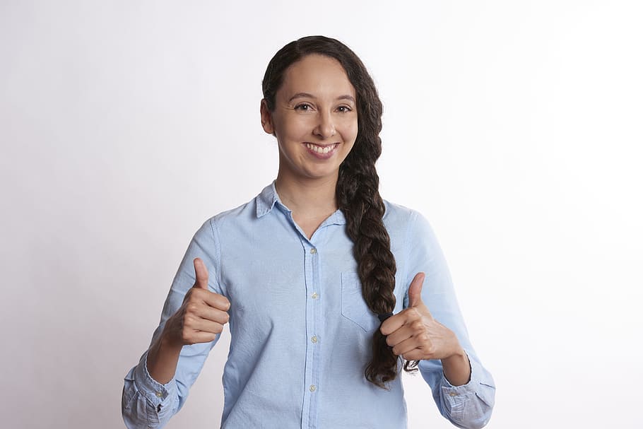 woman, braided, hair, wearing, teal button-up dress shirt, giving, two, thumbs, sign, Person