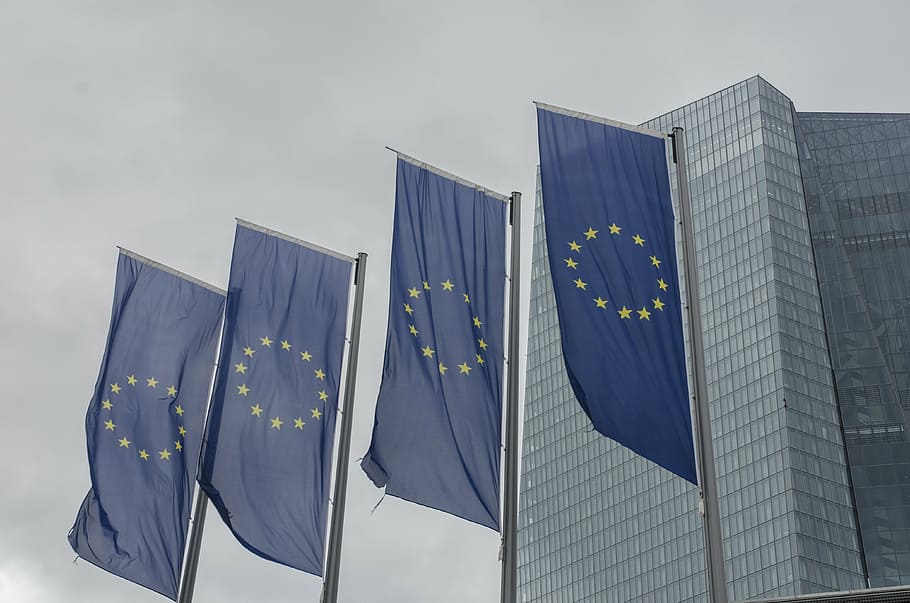 four blue-and-yellow flags, eu flag, frankfurt main, european central bank, sky, nature, flag, government, day, cloud - sky